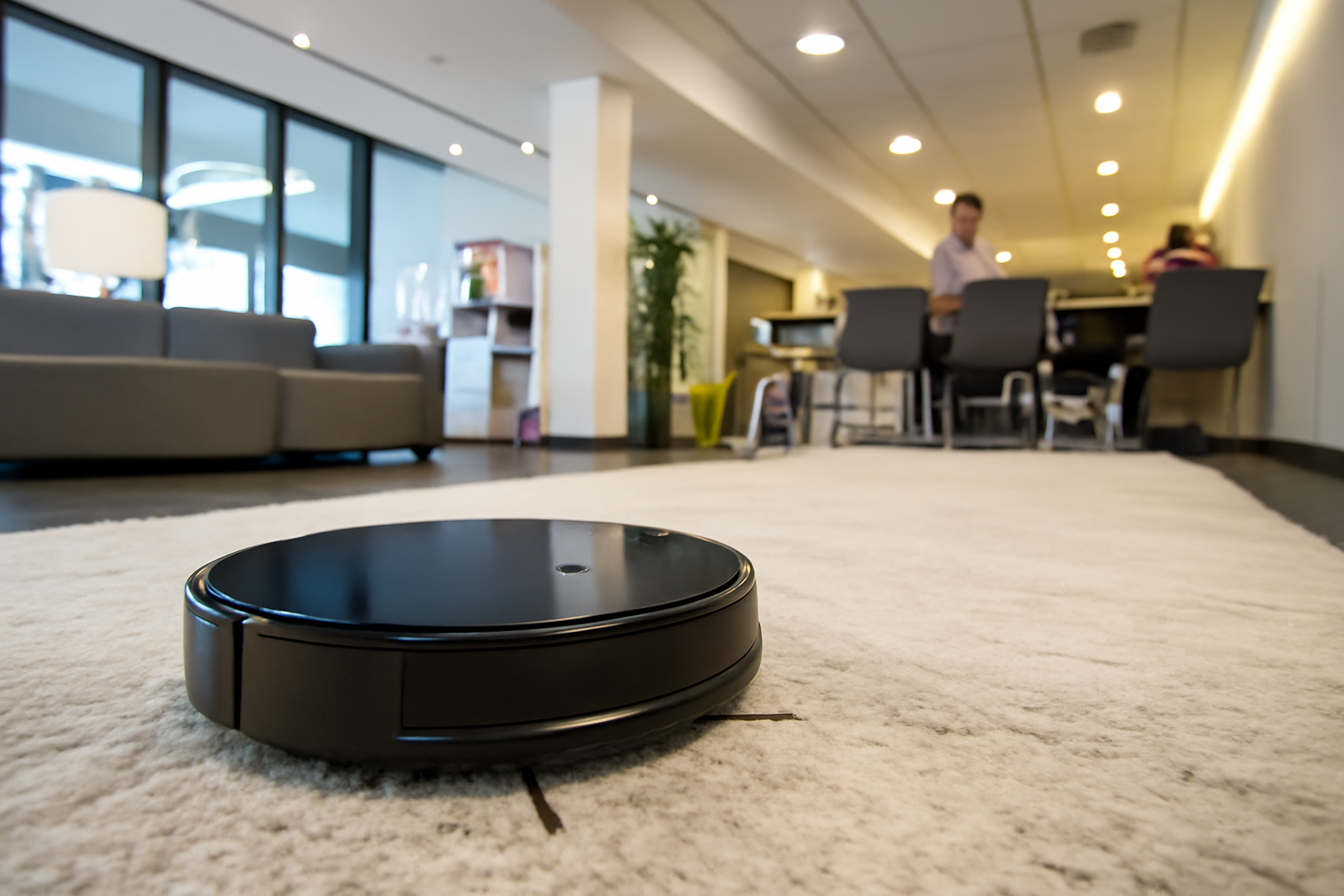 Robot vacuum operating in a modern office setting
